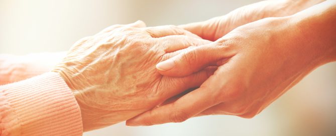 Two people holding hands